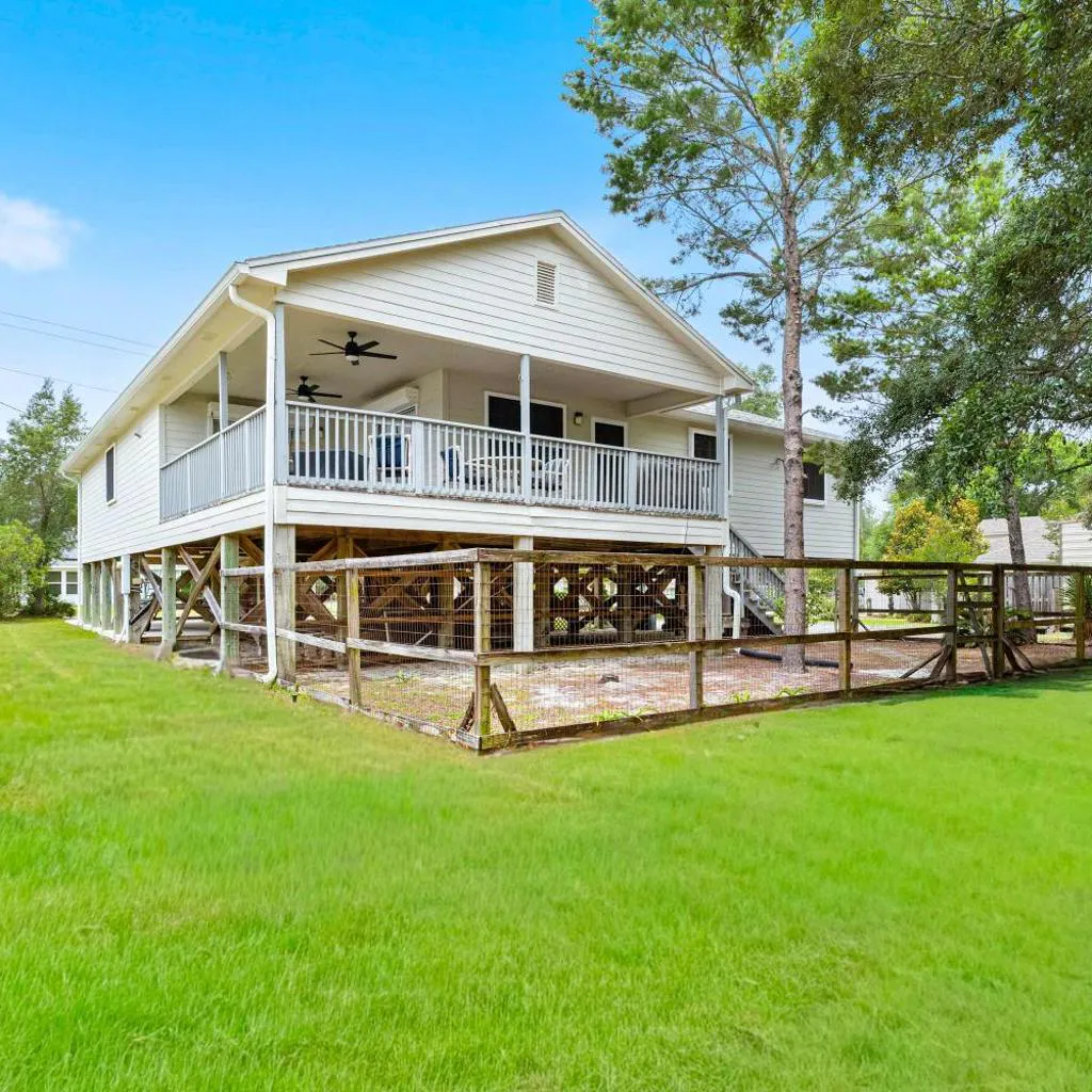 Photograph of 5BR Home Located on Canal Backyard with Deck and BBQ