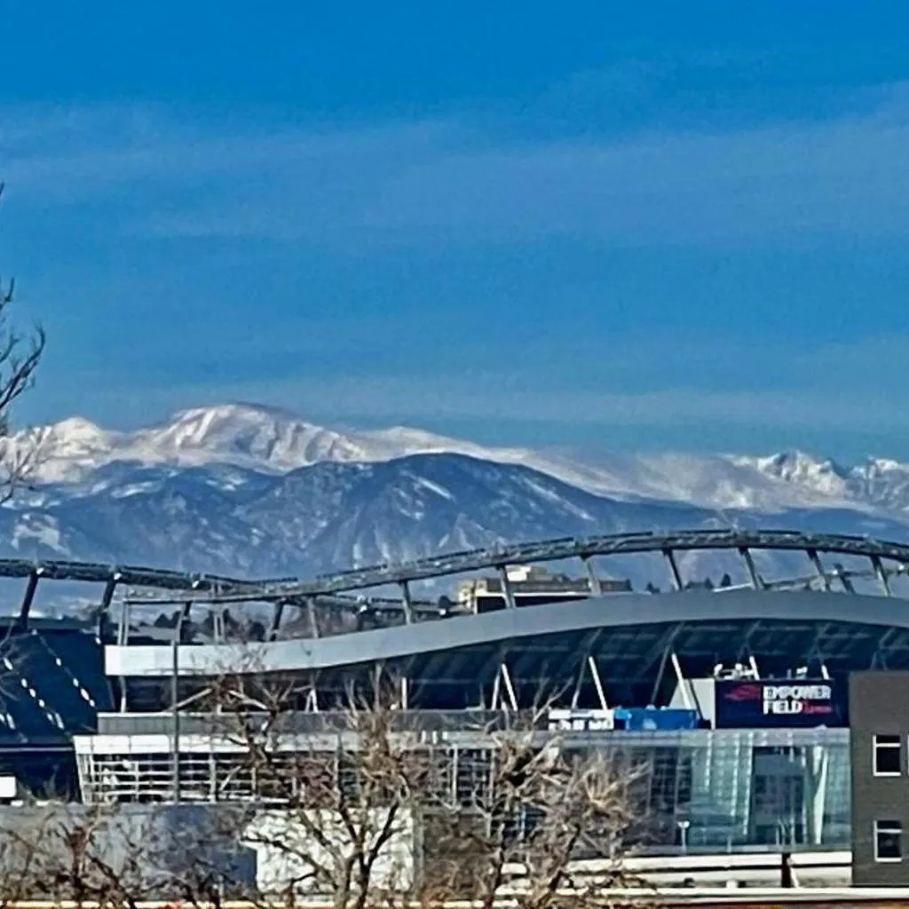 Photograph of Luxury Home with Rooftop City and Mountain Views Includes Huge Rooftop Patio with Daybed and Firepit