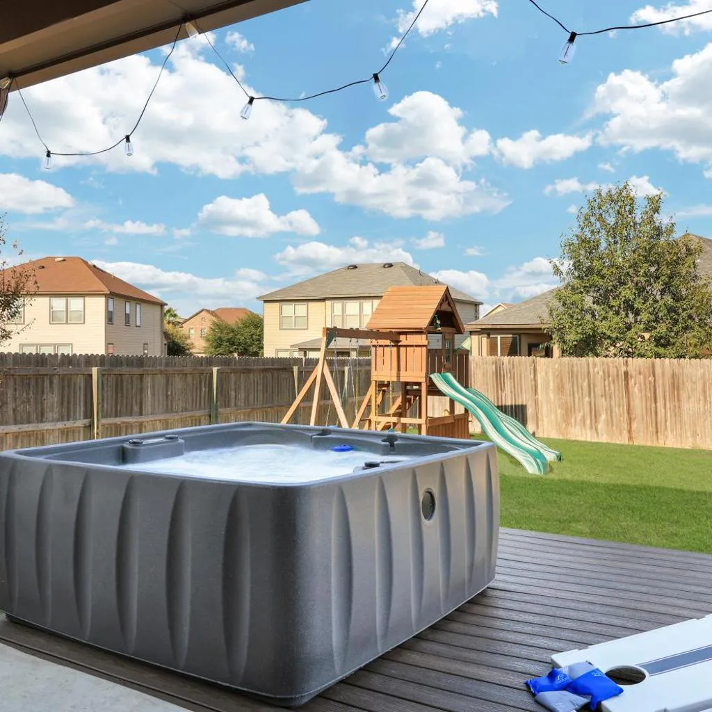 Photograph of Hot Tub Retreat Games BBQ Air Hockey Swing Set