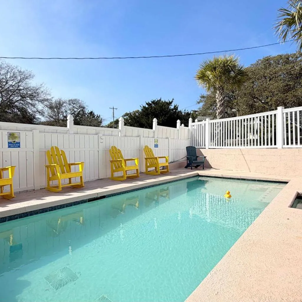 Photograph of Bright cheerful duplex with a pool A