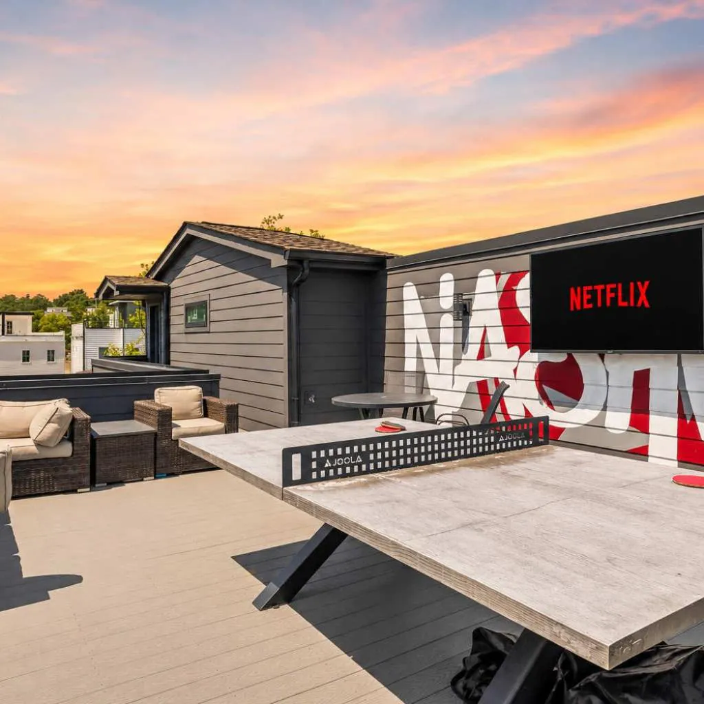 Photograph of Stylish Multi-Level Retreat Rooftop & Pool Table