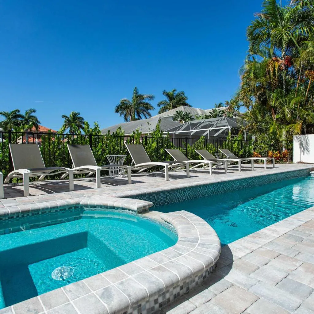 Photograph of Sorrento Vacation Rental and Cabana - Spacious 6 BR Retreat with Private Pool and Hot Tub! Pet Friendly, steps from Vanderbilt Beach with separate Cabana - Perfect for Large Groups and Families!