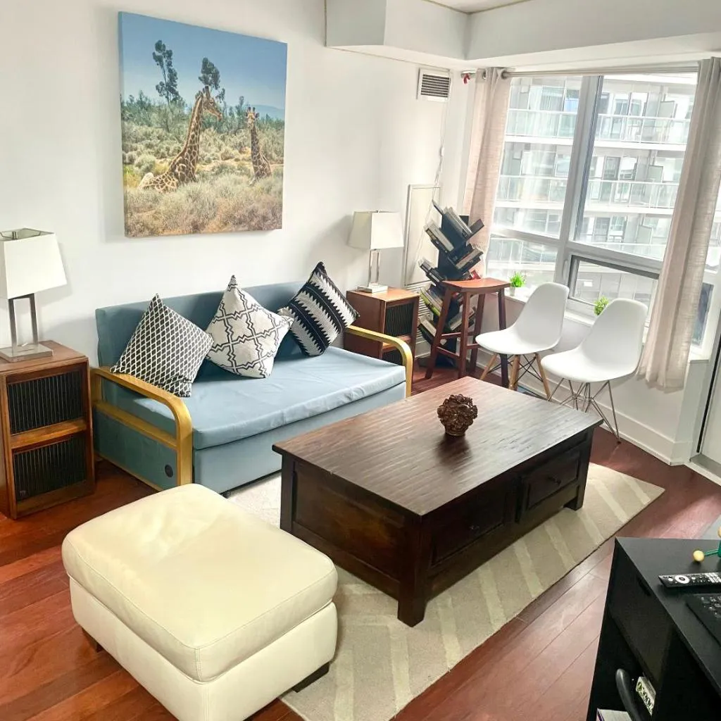 Photograph of Core Downtown Toronto-8 Sleeper-6 Beds-2 Bathrooms-Washrooms-Free Parking-CN Tower-Ripleys Museum-Blue Jays Stadium-Rogers Centre-Scotia Arena-MTCC-In front-Gym-Pool-Jacuzzi Sauna-Filter Drinking Water-WiFi-Cot