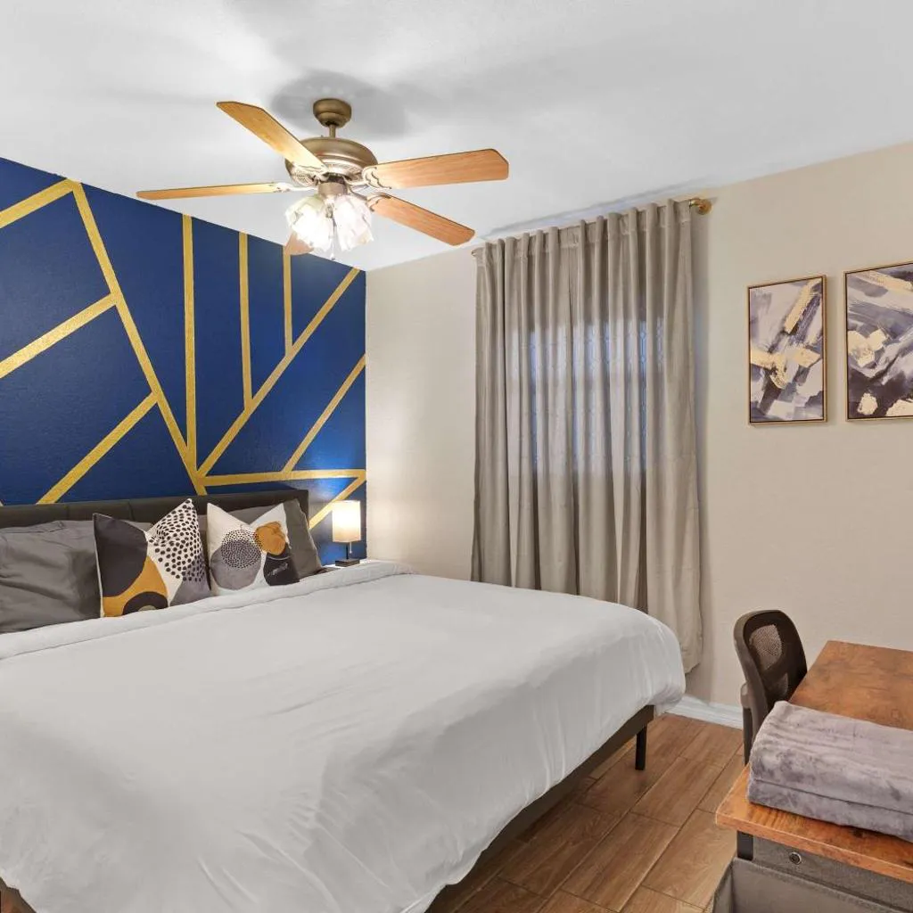 Photograph of King Bed & WFH Setup - Pet Friendly 1BR Stay
