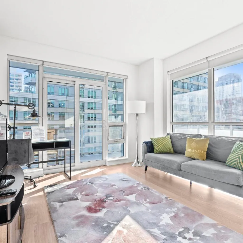 Photograph of Modern New 2Bd 2Ba &Den Condo with Balcony