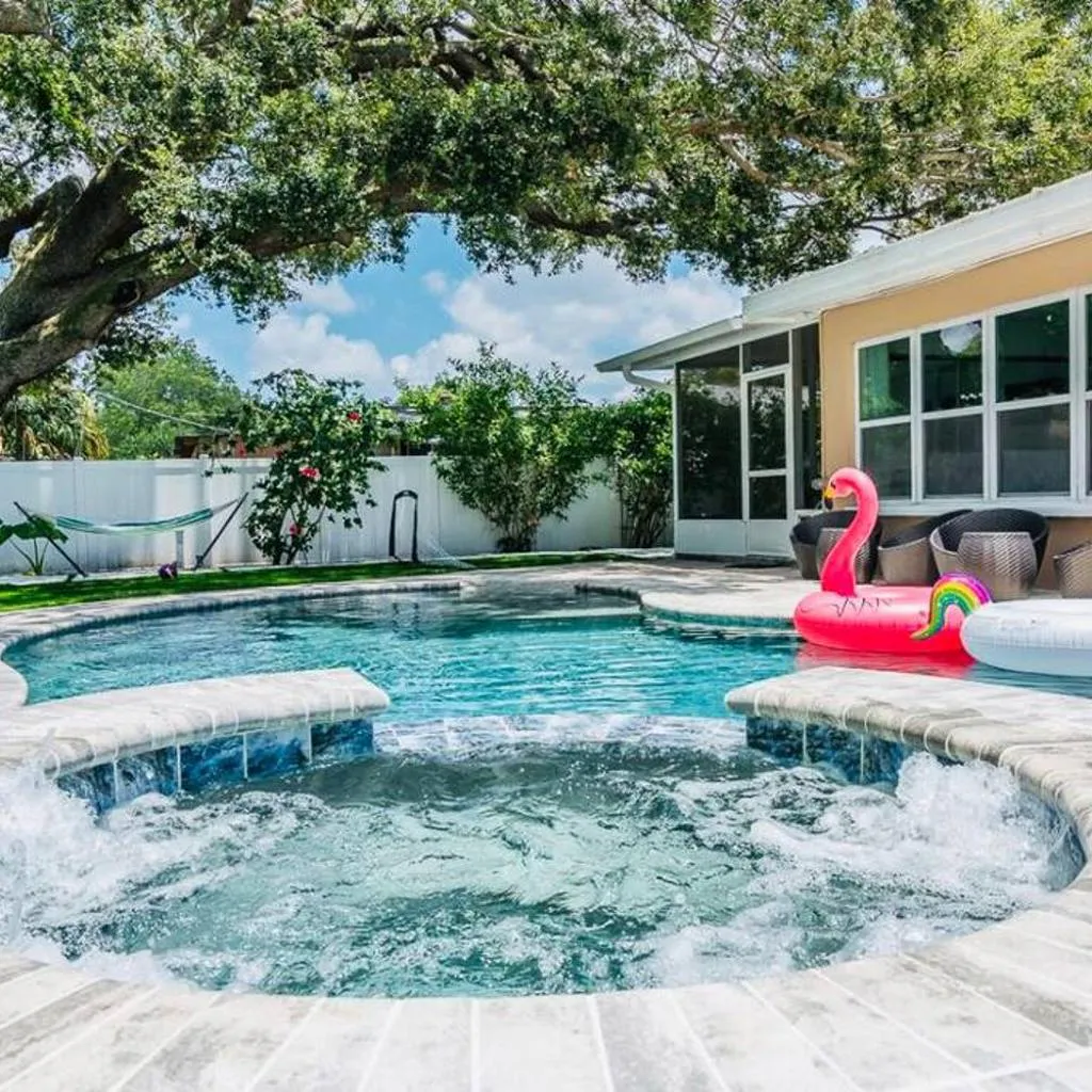 Photograph of Heated pool & jetted spa -- mins to beach