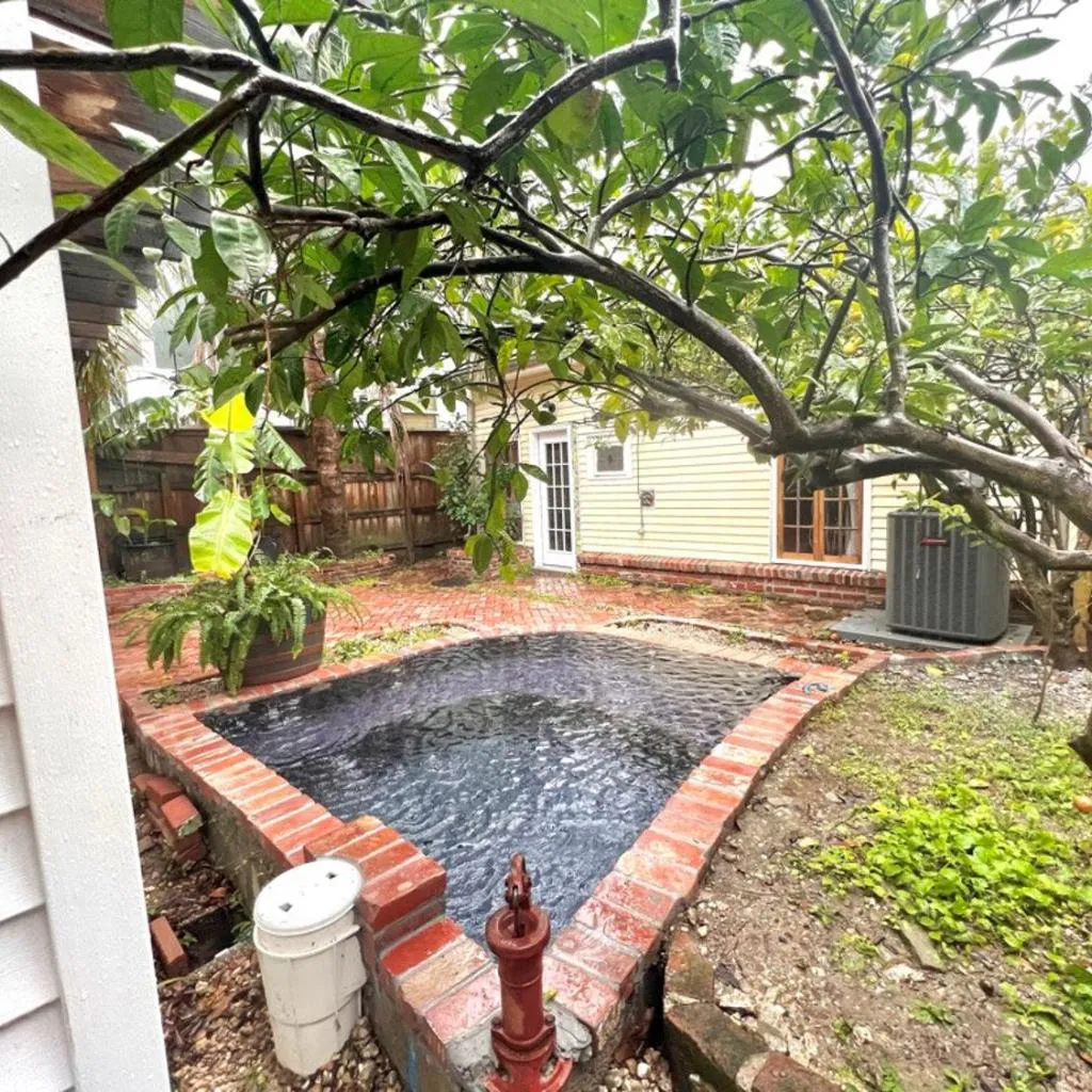 Photograph of A courtyard garden retreat with splash pool
