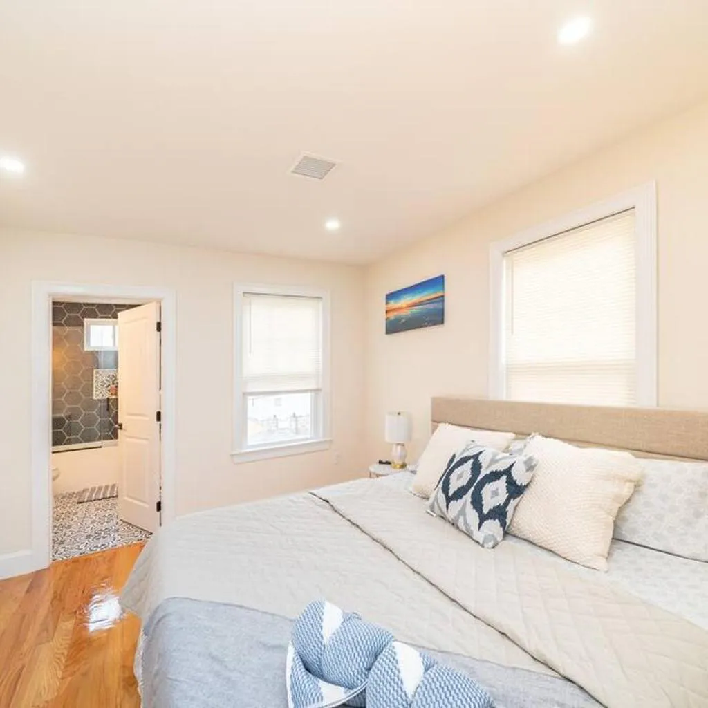 Photograph of Bright & Spacious 4BR & 2BA Boston Apt - Bathtub, Free Parking near Red Line 802