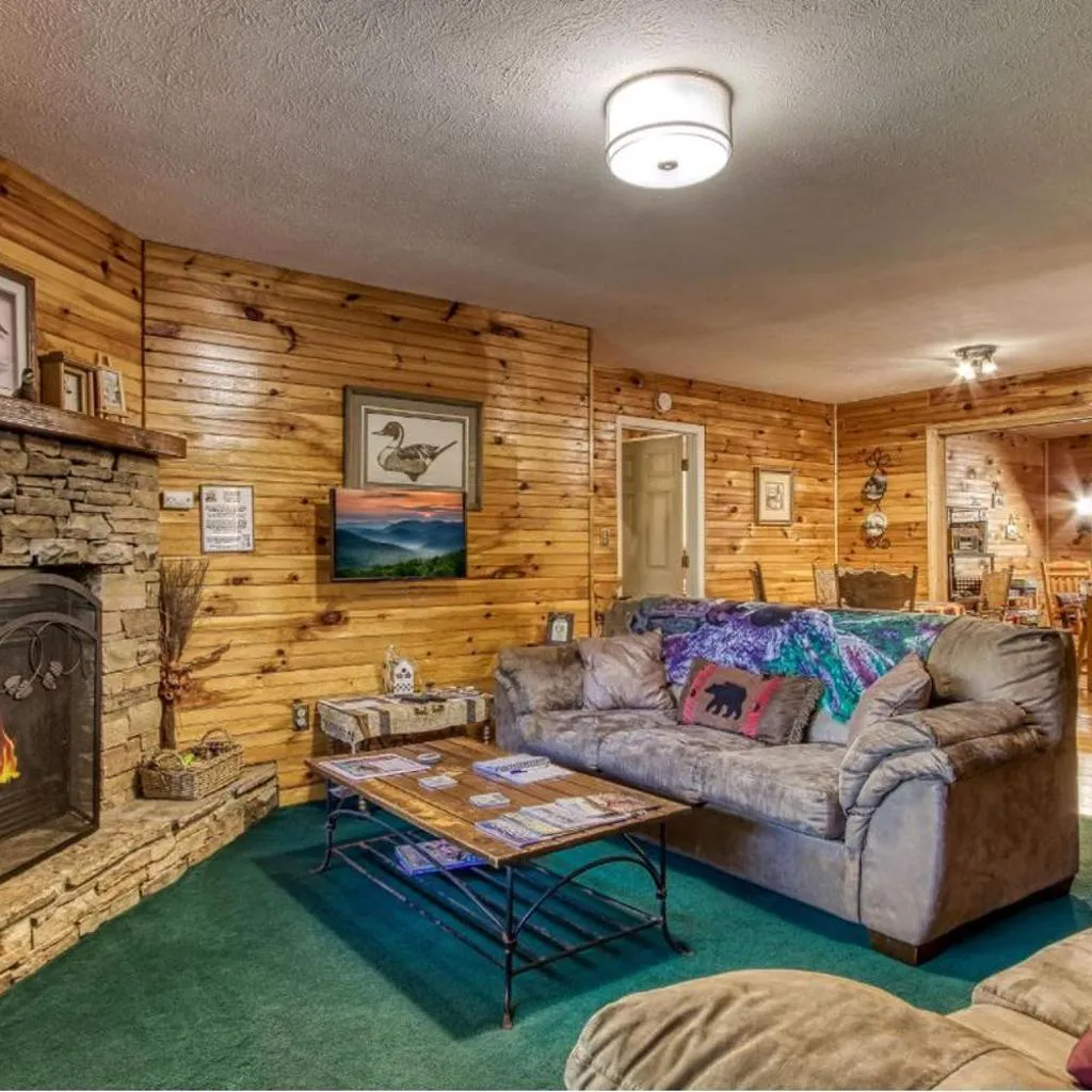 Photograph of Sunset Ridge Cabin - A Romantic Smoky Mountain Escape or Family Getaway with Privacy - behind Dollywood, large game room, jacuzzi tub, fire pit, large wrap-around deck, and more