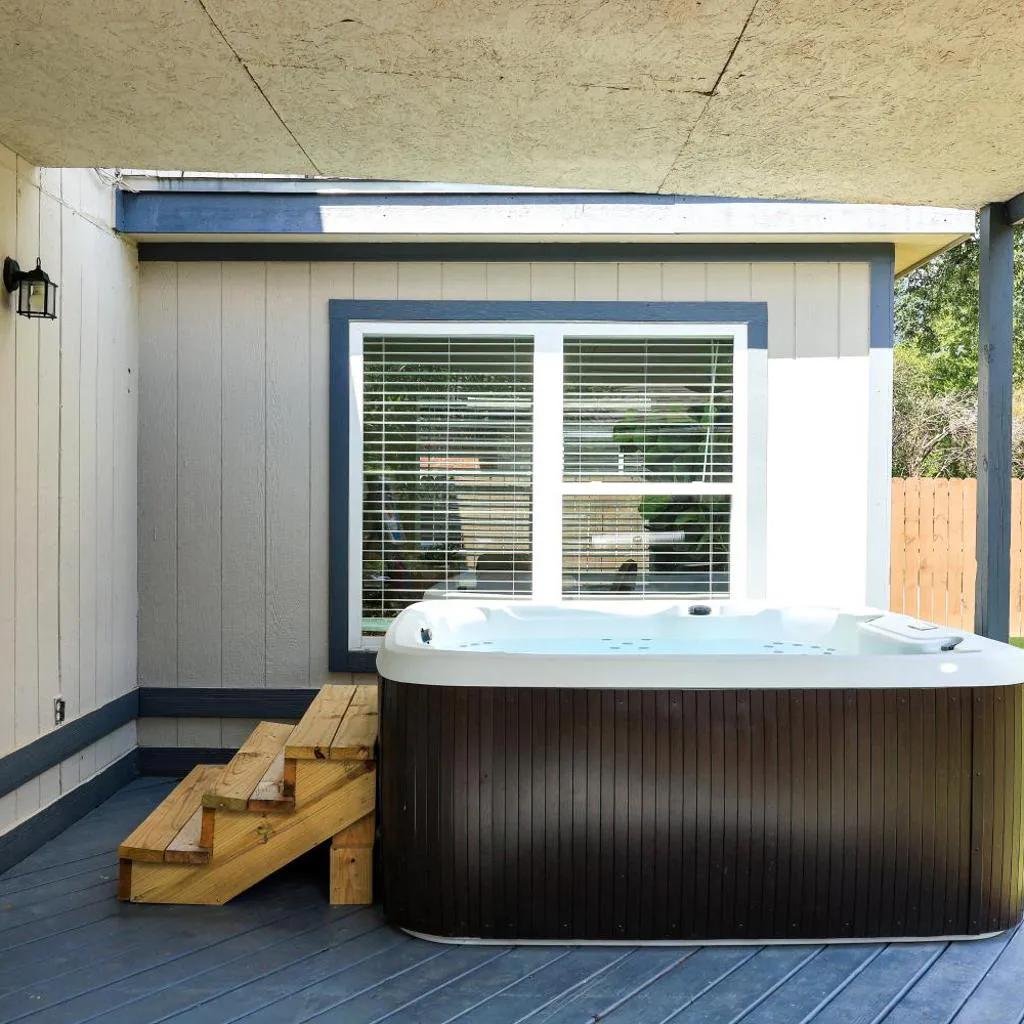 Photograph of Hot Tub Paradise Air Hockey Games Swing Set BBQ