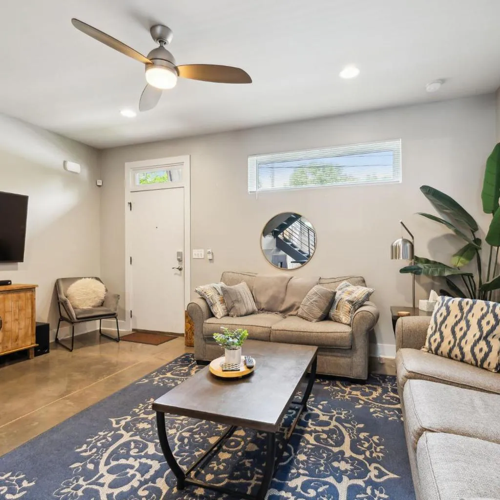 Photograph of Spacious 3-Story Townhome w Rooftop & City Views