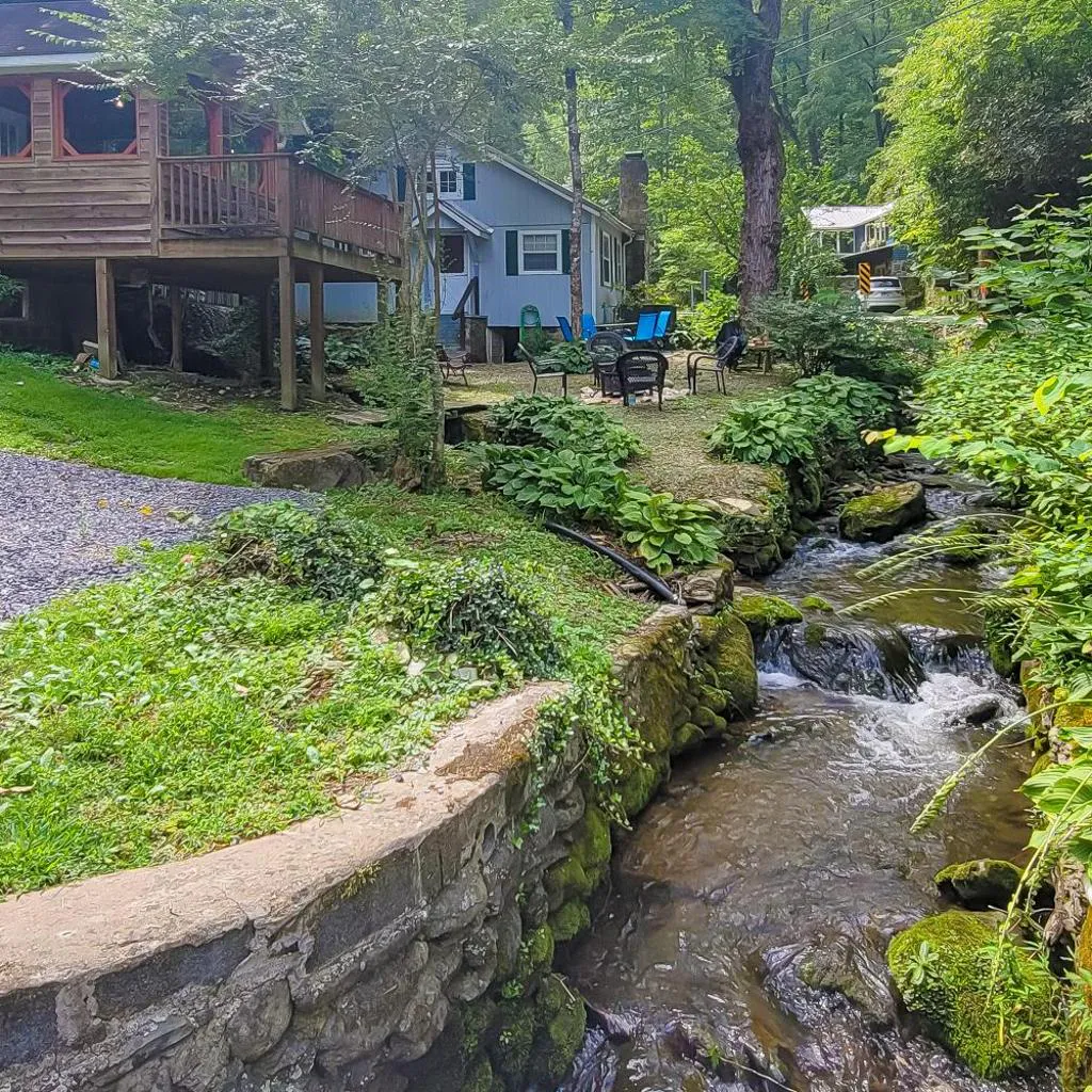 Photograph of Cozy Creekside Cabin Sleeps 12 Decks Free Tickets