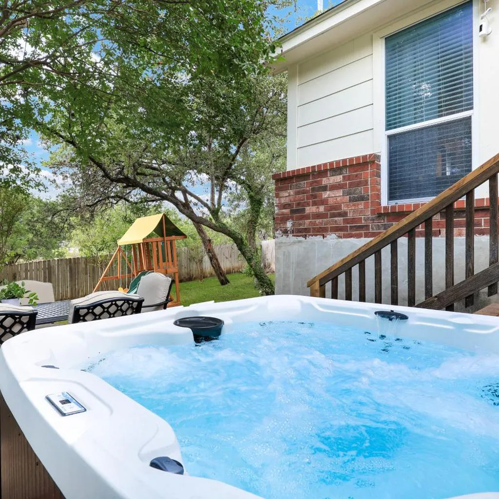 Photograph of Hot Tub Haven Yard Swing Set BBQ Games Desk WiFi