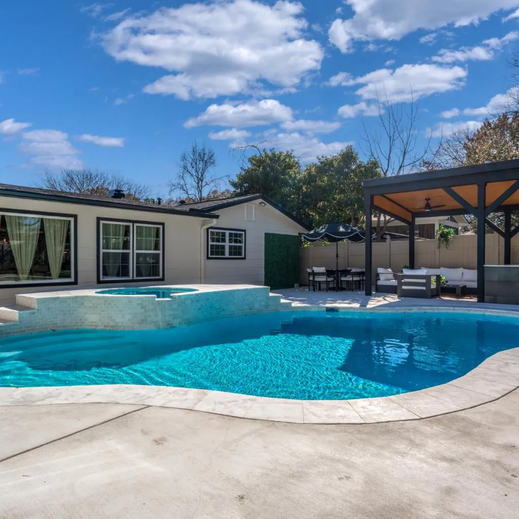 Photograph of Relaxed Luxury Pet Friendly Home with Pool and Backyard Lounge in San Antonio, TX