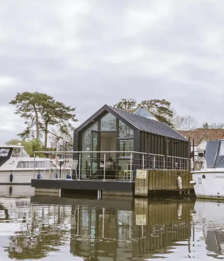 Photograph of Water Cabin With Water Sports Equipment and Bikes, Bath