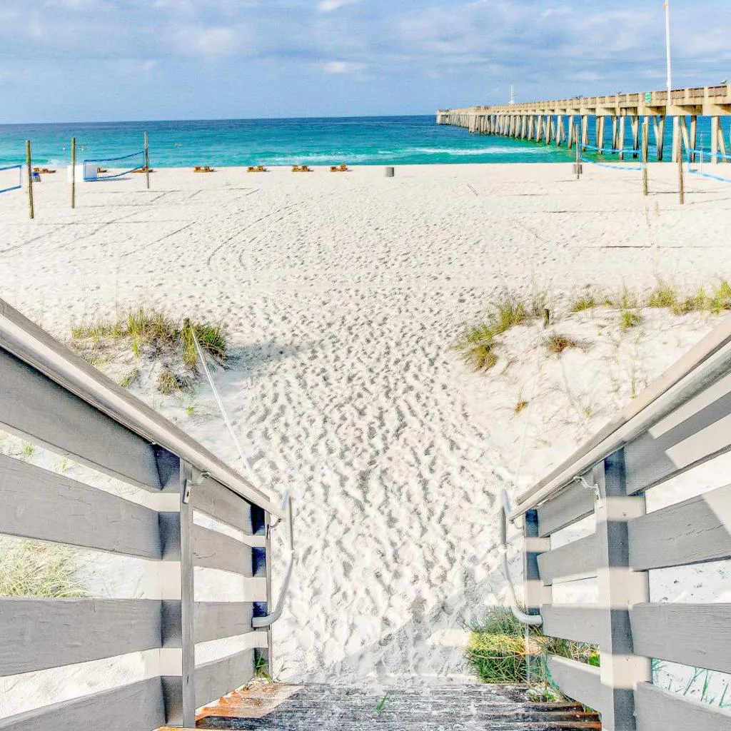 Photograph of Sunny condo near the sand with pool hot tub tennis smart TV W&D & AC