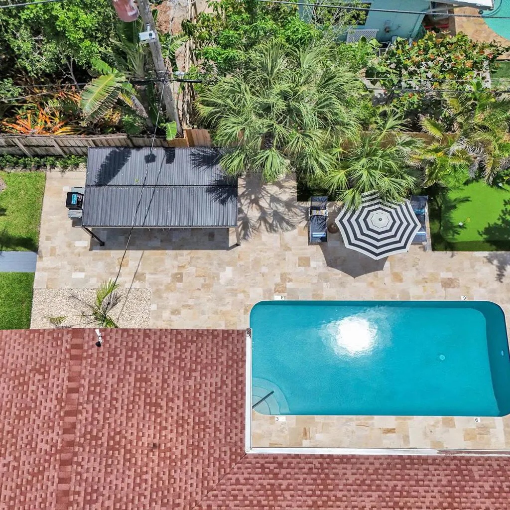 Photograph of Lauderdale Luxe Oasis -Heated pool-6min2Beach-Dream patio-Pergola-Golf-Game room