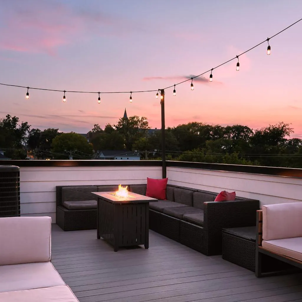 Photograph of Stylish 3 Bed Retreat, Rooftop, Parking, Sleeps 10, Ensuite Baths, Bunk Room, Gourmet Kitchen, Cozy Living Space, Rooftop Views & Fire Table, Near Downtown, Distilleries & Marathon Village, 24 Hr Hospitality