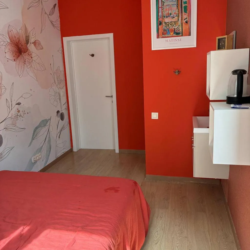 Photograph of Tastefully-decorated bedroom with garden access