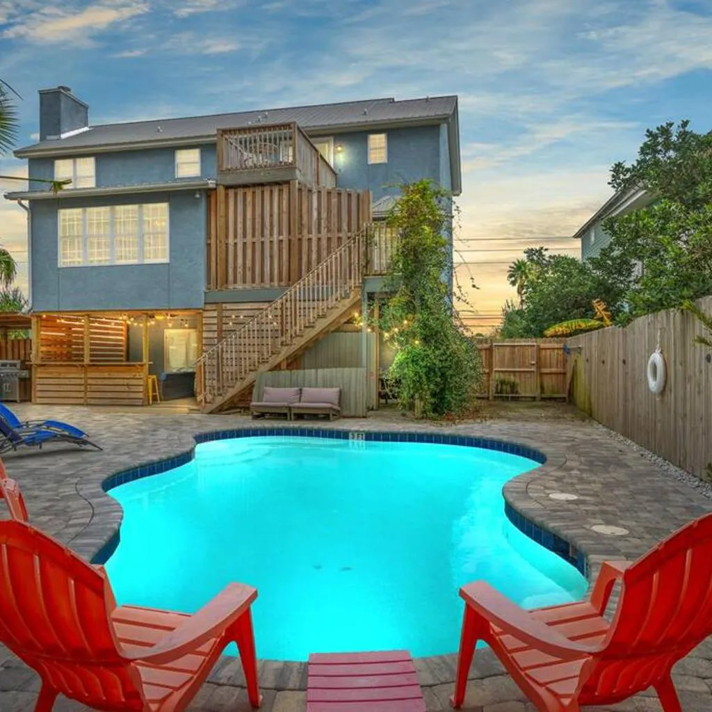 Photograph of Sand Castle-Pool, Game Rooms, covered outdoor space with tiki bar, 1min walk to beach