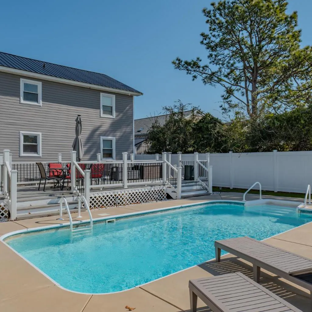 Photograph of Immaculate Upper Level Apartment With Putting Green and Pool! Pet Friendly 3 Bedroom - 2 Bath Unit B