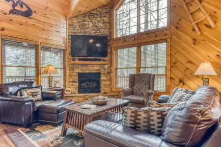 Photograph of Rustic Cabin with Hot Tub, Large Deck & Game Room Two King Suites and Loft Game Room Bunks, 10 Mins to Gatlinburg, 20 Mins to Parkway Great for Families, 24 Hr Hospitality, Dog Friendly